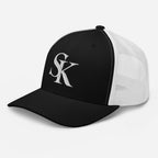 Saint Kingston black and white trucker cap – left front angle